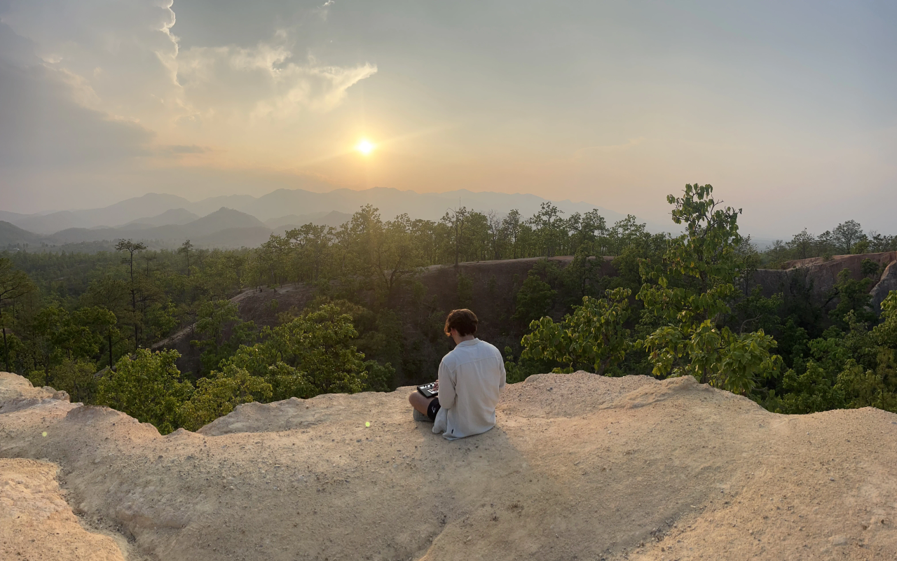 Didier Catz playing piano in a canyon in Thailand